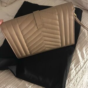 Brand new YSL wristlet bought at Saks never worn original box dust bag